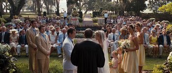 Movie still from “The Last Song” (2010), directed by Julie Anne Robinson – A couple getting married in front of a crowd of onlookers; Wide shot, High angle