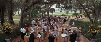 Movie still from “The Last Song” (2010), directed by Julie Anne Robinson – A large group of people standing under a tree; Extreme Wide shot, High angle