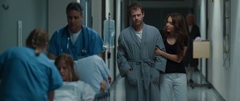 Movie still from “The Last Song” (2010), directed by Julie Anne Robinson – A couple of people standing next to each other in a room; Medium shot, Over the shoulder angle