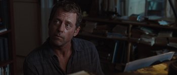 Movie still from “The Last Song” (2010), directed by Julie Anne Robinson – A person sitting at a table; Close Up shot, Over the shoulder angle