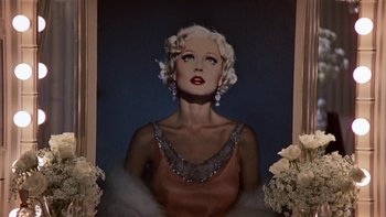 Movie still from “The Last Tycoon” (1976), directed by Elia Kazan – A painting of a woman in a pink dress; Close Up shot, Low angle