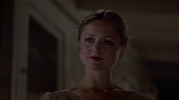 Movie still from “The Last Tycoon” (1976), directed by Elia Kazan – A beautiful woman with red lipstick in a dark room; Close Up shot, Low angle