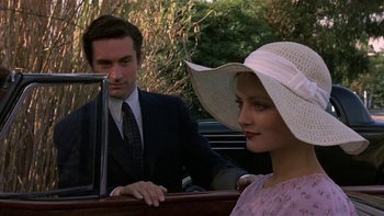 Movie still from “The Last Tycoon” (1976), directed by Elia Kazan – A man and a woman sitting in the back of a car; Close Up shot, Over the shoulder angle