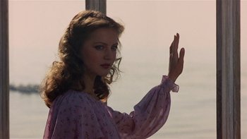 Movie still from “The Last Tycoon” (1976), directed by Elia Kazan – A beautiful young lady wearing a purple dress; Close Up shot, Low angle