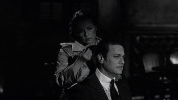 Movie still from “The Last Tycoon” (1976), directed by Elia Kazan – A man and a woman are getting their hair cut together; Close Up shot, Over the shoulder angle