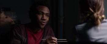Movie still from “The Lazarus Effect” (2015), directed by David Gelb – A man holding a pair of chopsticks in his hands; Close Up shot, Over the shoulder angle