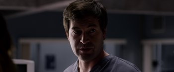 Movie still from “The Lazarus Effect” (2015), directed by David Gelb – A person wearing a gray shirt; Close Up shot, Over the shoulder angle