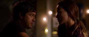 Movie still from “The Lazarus Effect” (2015), directed by David Gelb – A man and a woman face to face in the dark; Close Up shot, Over the shoulder angle