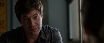 Movie still from “The Lazarus Effect” (2015), directed by David Gelb – A person sitting in a room; Close Up shot, Over the shoulder angle