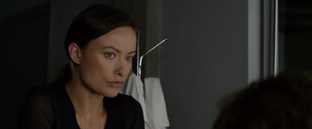 Movie still from “The Lazarus Effect” (2015), directed by David Gelb – A person looking at a mirror; Close Up shot, Over the shoulder angle