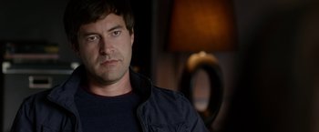 Movie still from “The Lazarus Effect” (2015), directed by David Gelb – A person wearing a jacket; Close Up shot, Over the shoulder angle