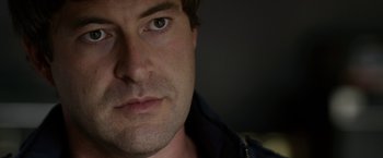 Movie still from “The Lazarus Effect” (2015), directed by David Gelb – A man's face with green eyes; Close Up shot, Over the shoulder angle