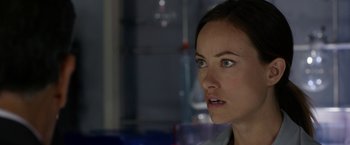 Movie still from “The Lazarus Effect” (2015), directed by David Gelb – A woman's face in a dark room; Close Up shot, Over the shoulder angle