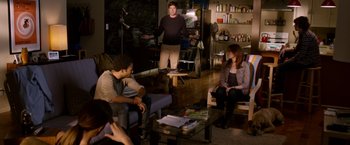 Movie still from “The Lazarus Effect” (2015), directed by David Gelb – A group of people sitting in a living room; Wide shot, Over the shoulder angle