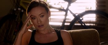 Movie still from “The Lazarus Effect” (2015), directed by David Gelb – A person sitting on a couch; Close Up shot, Over the shoulder angle