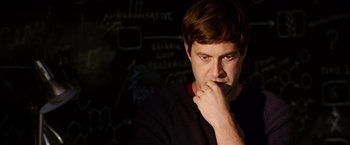 Movie still from “The Lazarus Effect” (2015), directed by David Gelb – A man with his chin resting on his hand; Close Up shot, Over the shoulder angle