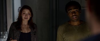 Movie still from “The Lazarus Effect” (2015), directed by David Gelb – A man and a woman standing next to each other in the dark; Close Up shot, Low angle