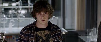 Movie still from “The Lazarus Effect” (2015), directed by David Gelb – A young man in a plaid shirt is looking at the camera; Close Up shot, Over the shoulder angle