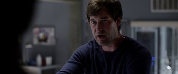 Movie still from “The Lazarus Effect” (2015), directed by David Gelb – A person sitting in front of a window; Close Up shot, Over the shoulder angle