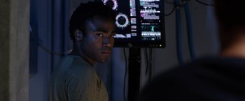 Movie still from “The Lazarus Effect” (2015), directed by David Gelb – A young man in front of a computer monitor; Close Up shot, Over the shoulder angle