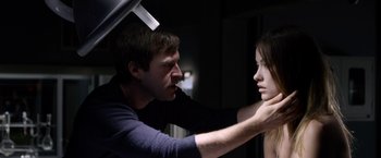 Movie still from “The Lazarus Effect” (2015), directed by David Gelb – A man and a woman are looking at each other's face; Close Up shot, Over the shoulder angle