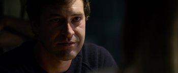 Movie still from “The Lazarus Effect” (2015), directed by David Gelb – A man's face in a dark room; Close Up shot, Over the shoulder angle