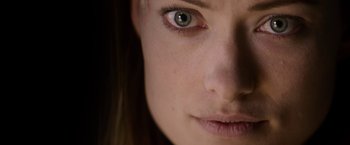 Movie still from “The Lazarus Effect” (2015), directed by David Gelb – A woman's face with green eyes; Extreme Close Up shot, Over the shoulder angle