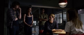 Movie still from “The Lazarus Effect” (2015), directed by David Gelb – A man and a woman standing next to another man in a room; Medium shot, Over the shoulder angle