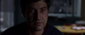 Movie still from “The Lazarus Effect” (2015), directed by David Gelb – A man's face in the dark; Close Up shot, Over the shoulder angle