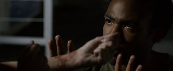 Movie still from “The Lazarus Effect” (2015), directed by David Gelb – A man with his hands in the air; Extreme Close Up shot, Over the shoulder angle