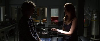 Movie still from “The Lazarus Effect” (2015), directed by David Gelb – A man and a woman are talking in a room; Medium shot, Over the shoulder angle