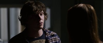 Movie still from “The Lazarus Effect” (2015), directed by David Gelb – A young man is looking at the camera; Close Up shot, Over the shoulder angle