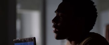 Movie still from “The Lazarus Effect” (2015), directed by David Gelb – A person looking at a cell phone; Close Up shot, Low angle