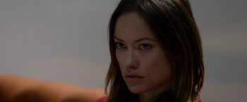 Movie still from “The Lazarus Effect” (2015), directed by David Gelb – A person with long brown hair; Close Up shot, Over the shoulder angle