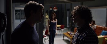 Movie still from “The Lazarus Effect” (2015), directed by David Gelb – A man and a woman standing in front of another man; Medium shot, Over the shoulder angle