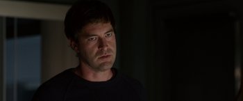 Movie still from “The Lazarus Effect” (2015), directed by David Gelb – A person wearing a black t - shirt; Close Up shot, Over the shoulder angle