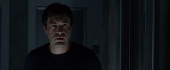 Movie still from “The Lazarus Effect” (2015), directed by David Gelb – A person wearing a black t - shirt; Close Up shot, Low angle