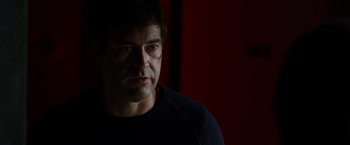 Movie still from “The Lazarus Effect” (2015), directed by David Gelb – A person with a scar on his face; Close Up shot, Over the shoulder angle