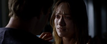 Movie still from “The Lazarus Effect” (2015), directed by David Gelb – A young woman is crying as a young man looks at her; Close Up shot, Over the shoulder angle