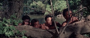 Movie still from “The Learning Tree” (1969), directed by Gordon Parks – A group of people in a body of water; Medium shot, High angle