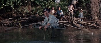 Movie still from “The Learning Tree” (1969), directed by Gordon Parks – An old man in a boat in the water; Wide shot, High angle