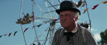 Movie still from “The Learning Tree” (1969), directed by Gordon Parks – An older man wearing a black and white striped shirt and a black hat; Close Up shot, Low angle