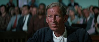 Movie still from “The Learning Tree” (1969), directed by Gordon Parks – An older man is looking into the distance; Close Up shot, High angle