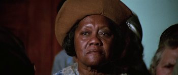 Movie still from “The Learning Tree” (1969), directed by Gordon Parks – An older woman wearing a brown cowboy hat; Close Up shot, Low angle
