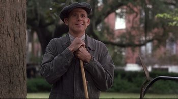 Movie still from “The Legend of Bagger Vance” (2000), directed by Robert Redford – A man holding a stick in his hands; Medium shot, Low angle
