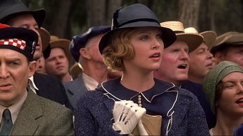 Movie still from “The Legend of Bagger Vance” (2000), directed by Robert Redford – A group of people standing in a crowd wearing hats; Close Up shot, Low angle
