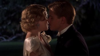Movie still from “The Legend of Bagger Vance” (2000), directed by Robert Redford – A man and a woman are kissing in the dark; Close Up shot, Low angle
