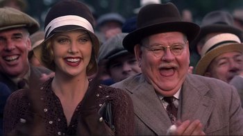 Movie still from “The Legend of Bagger Vance” (2000), directed by Robert Redford – An older man and a young woman wearing hats; Close Up shot, Low angle