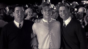 Movie still from “The Legend of Bagger Vance” (2000), directed by Robert Redford – A group of men standing next to each other; Medium shot, Low angle