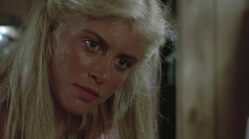 Movie still from “The Legend of Billie Jean” (1985), directed by Matthew Robbins – A person with blonde hair and green eyes; Close Up shot, Over the shoulder angle